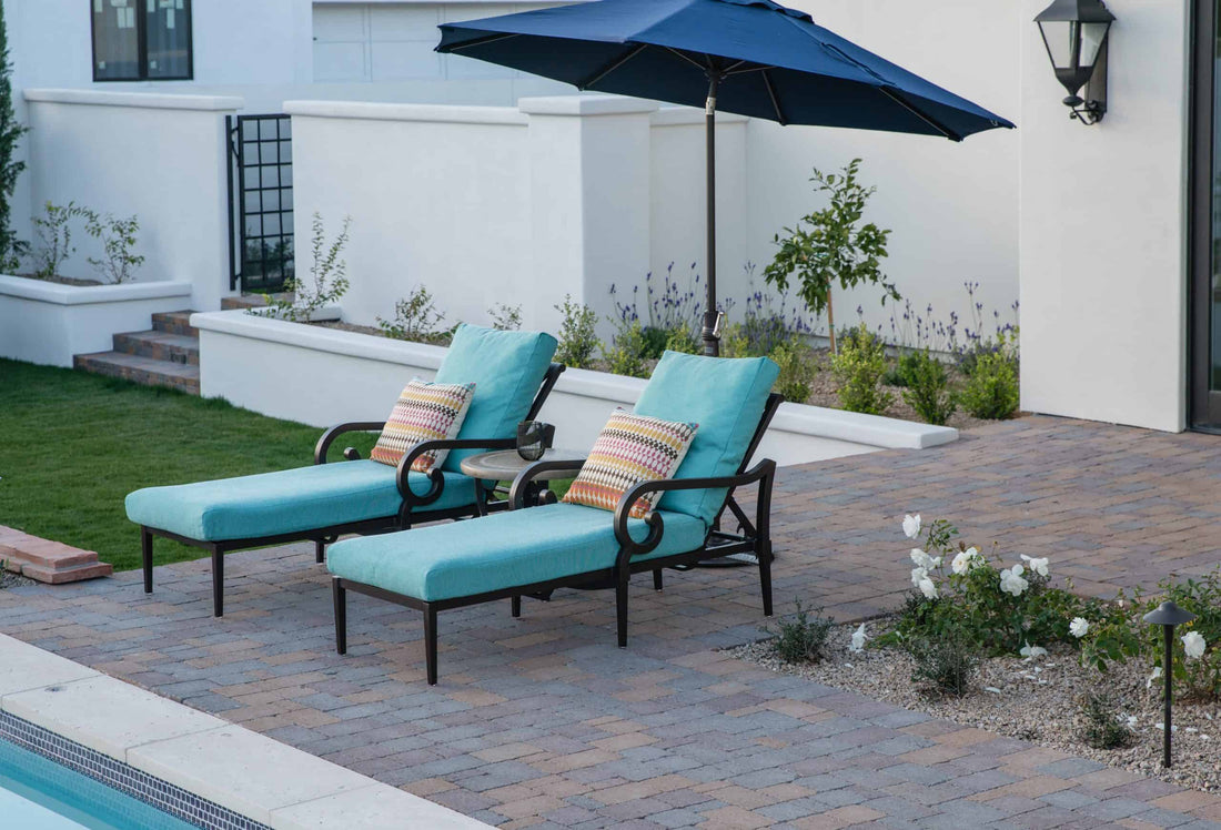 Two outdoor chaise lounge chairs by the pool