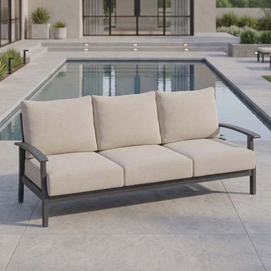 The Rockport sofa from Paddy O' Furniture featuring plush outdoor cushions on a terrace.