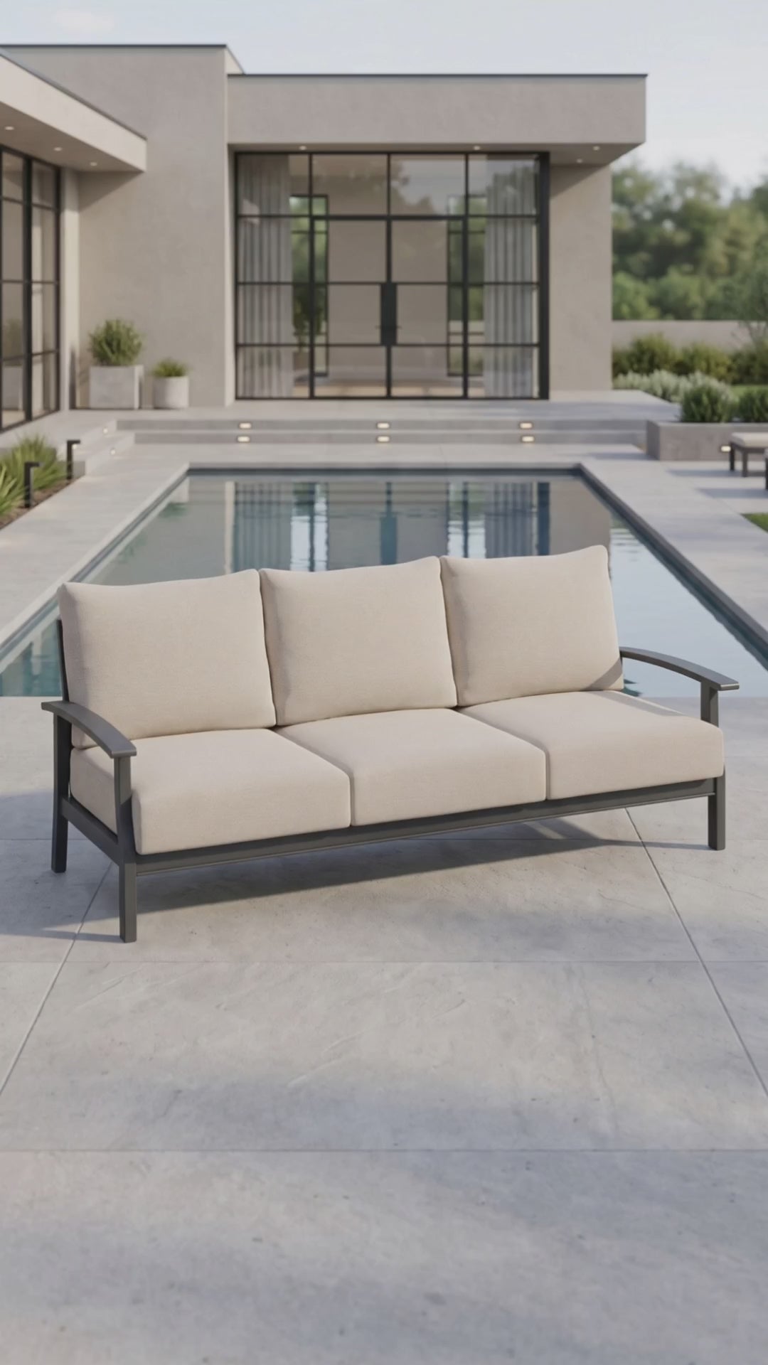 The Rockport sofa from Paddy O' Furniture featuring plush outdoor cushions on a terrace.