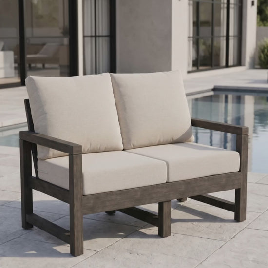 Paddy O' Furniture Lakeside Loveseat with Bliss cushions for luxury outdoor relaxation.