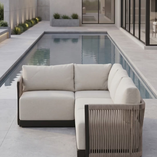The Resort 4-Seat Sectional from Paddy O' Furniture features plush cushions in an outdoor patio setting.