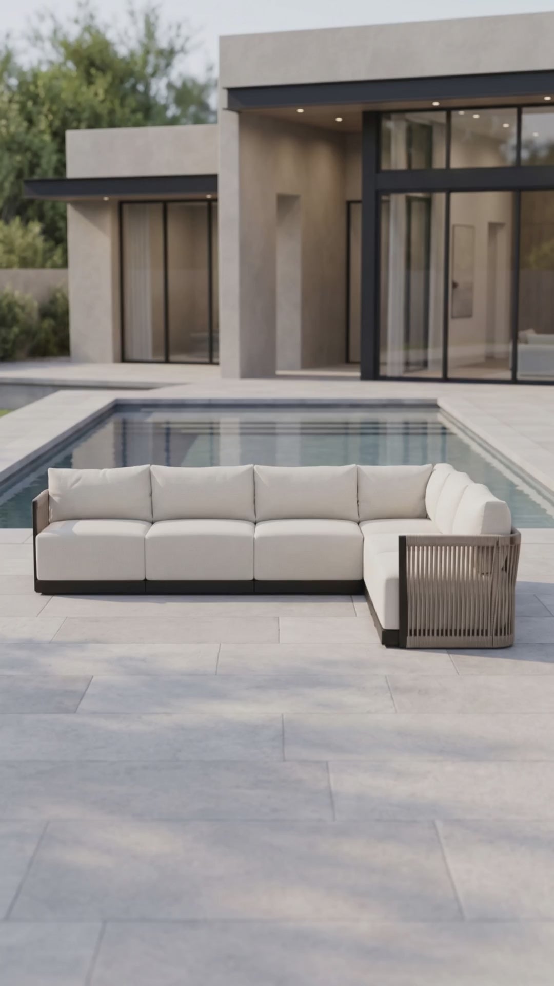 Paddy O' Furniture Resort 6-seat outdoor sectional sofa set with Bliss cushions on a patio.