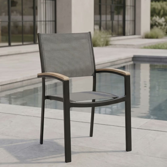 Mission Stackable Sling Dining Chair in an outdoor patio setting by Paddy O' Furniture