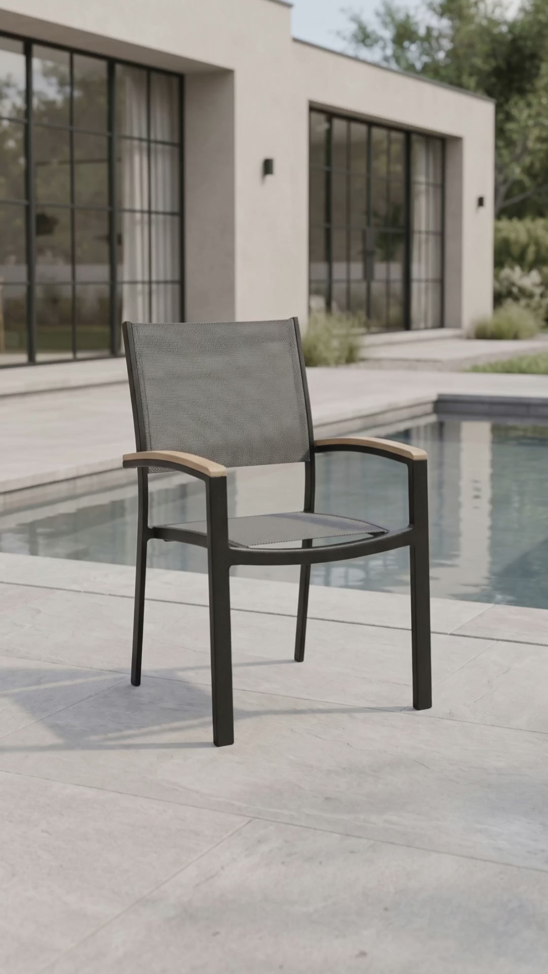 Mission Stackable Sling Dining Chair in an outdoor patio setting by Paddy O' Furniture