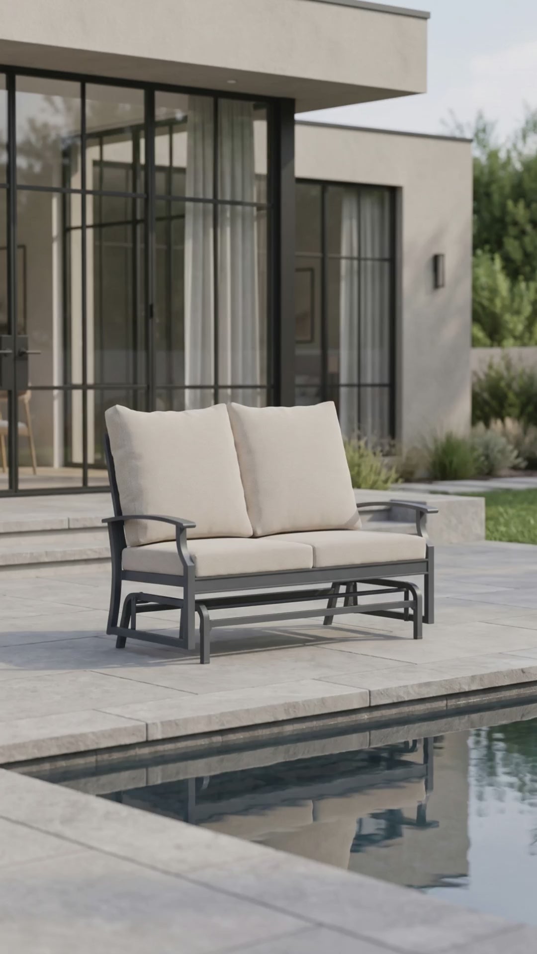 Paddy O' Furniture Rockport outdoor double glider with plush Bliss cushions in a serene outdoor setting