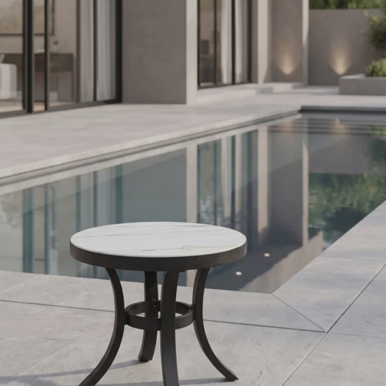 Modern outdoor round end table with a smooth tabletop and durable base by Paddy O' Furniture