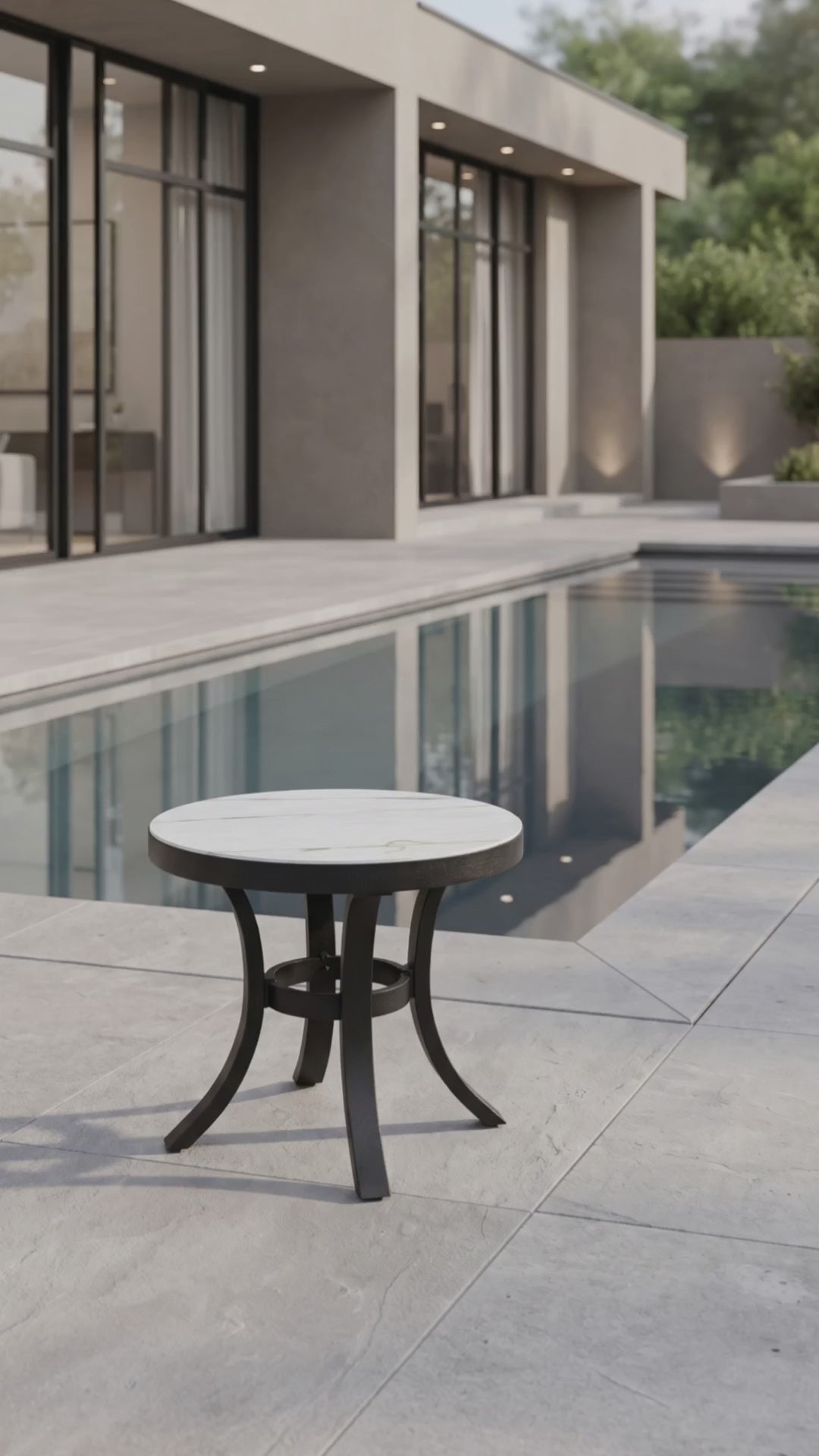 Modern outdoor round end table with a smooth tabletop and durable base by Paddy O' Furniture