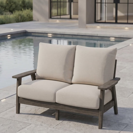 Patriot Loveseat by Paddy O' Furniture featuring deep Bliss cushions for outdoor relaxation.