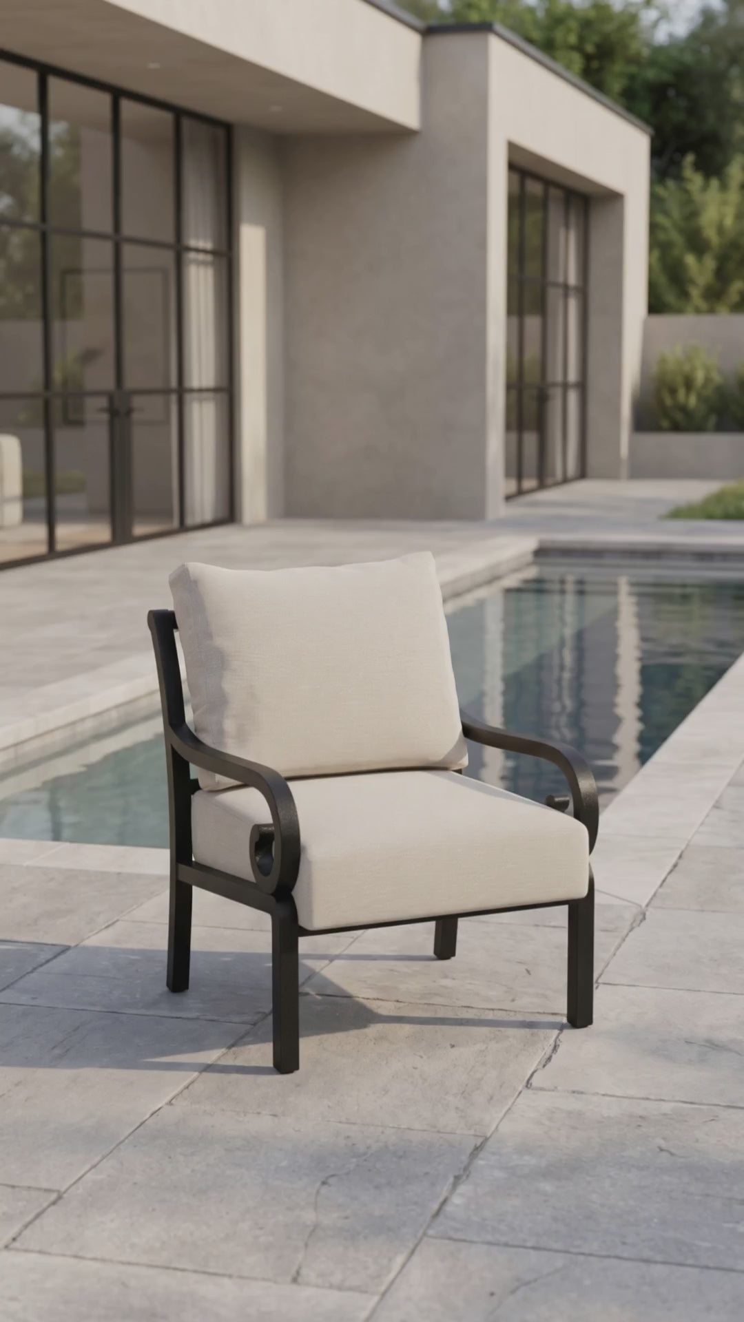 Club chair with scrolled arms and oatmeal bliss cushions.