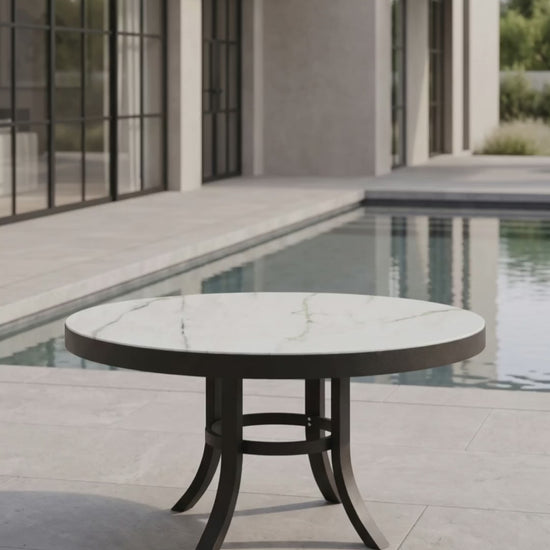 Round outdoor coffee table centerpiece with a sturdy base and smooth top by Paddy O' Furniture