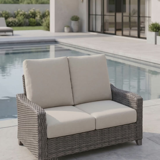 Paddy O' Furniture Edge Hill Loveseat featuring deep cushions for outdoor patio relaxation.