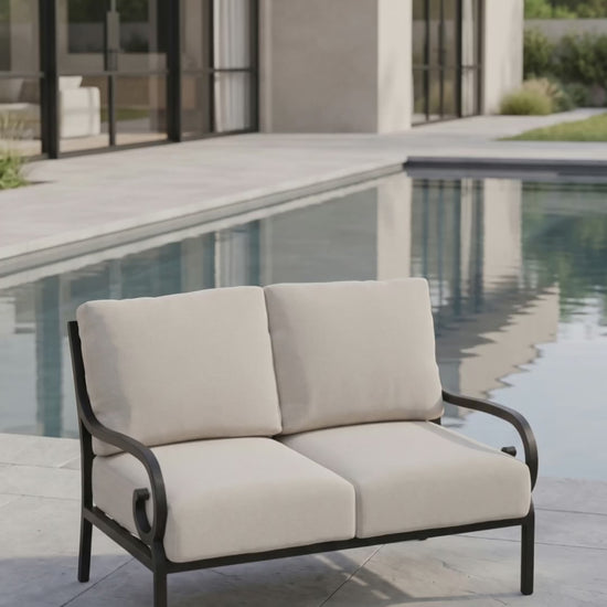 Paddy O' Furniture Rancho Loveseat with comfortable Bliss cushions for patio or terrace.