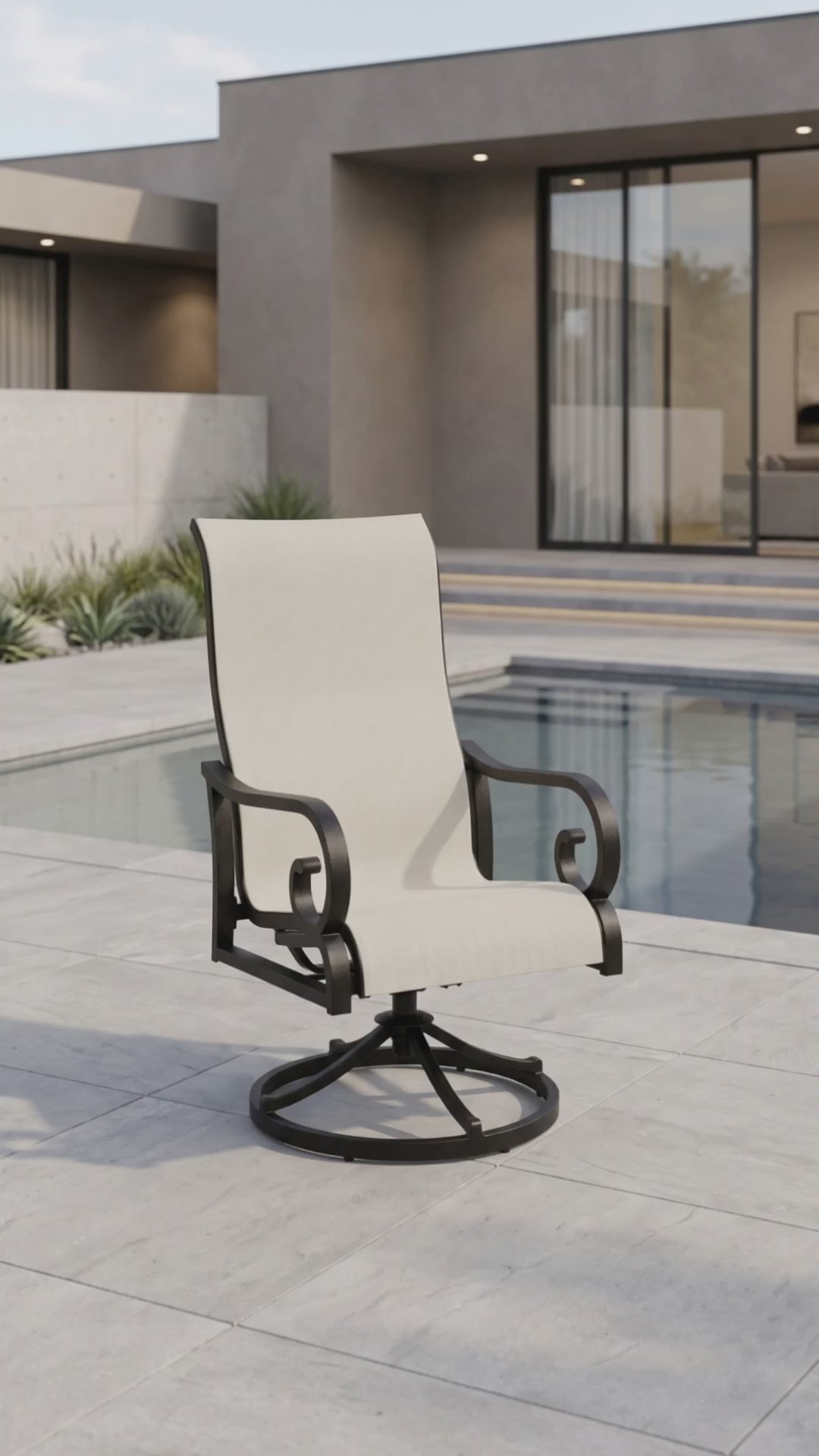 a traditional sling outdoor dining chair with scrolled arms