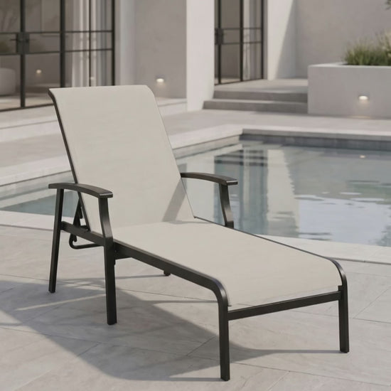 Newport Sling Chaise with breathable mesh surface for outdoor relaxation by Paddy O' Furniture.