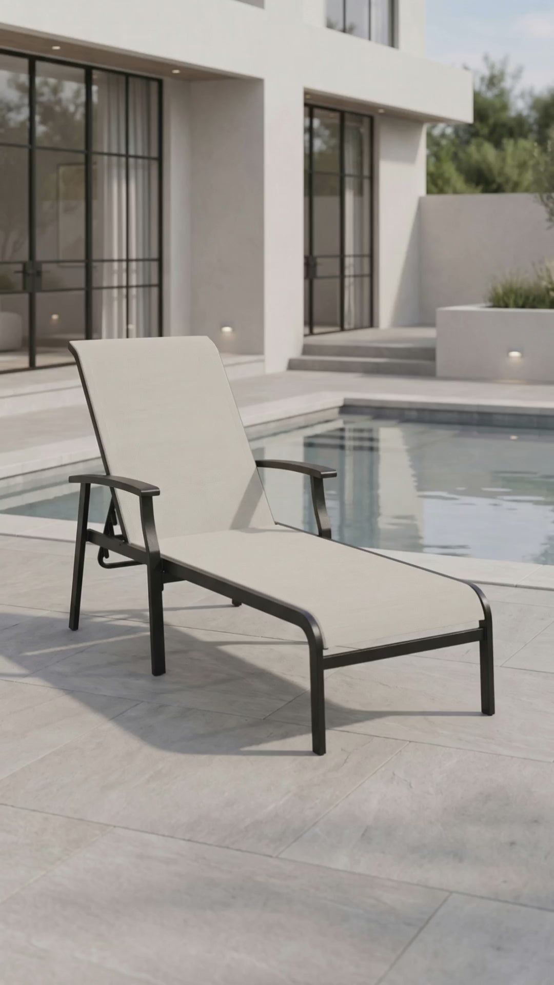Newport Sling Chaise with breathable mesh surface for outdoor relaxation by Paddy O' Furniture.