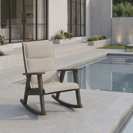 Patriot padded sling rocking chair by Paddy O' Furniture on a porch.