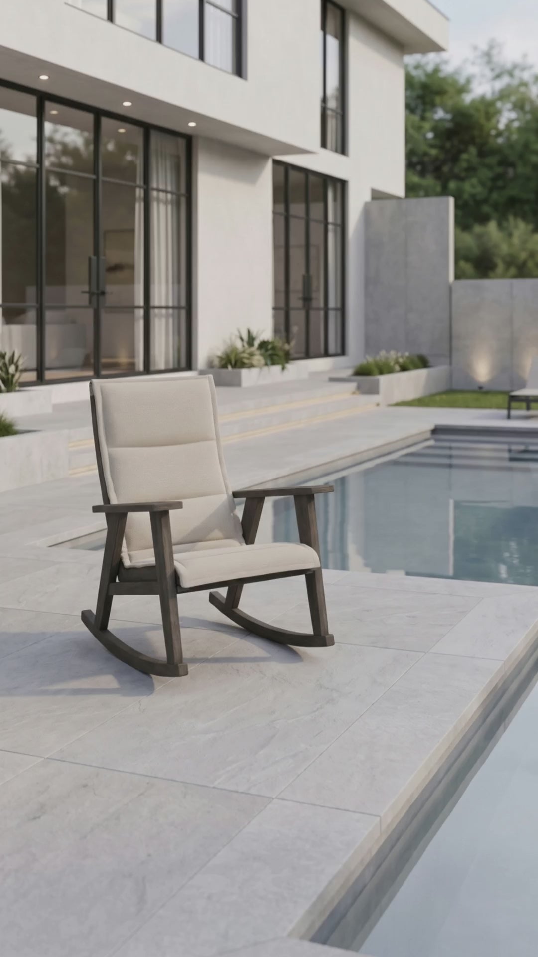 Patriot padded sling rocking chair by Paddy O' Furniture on a porch.