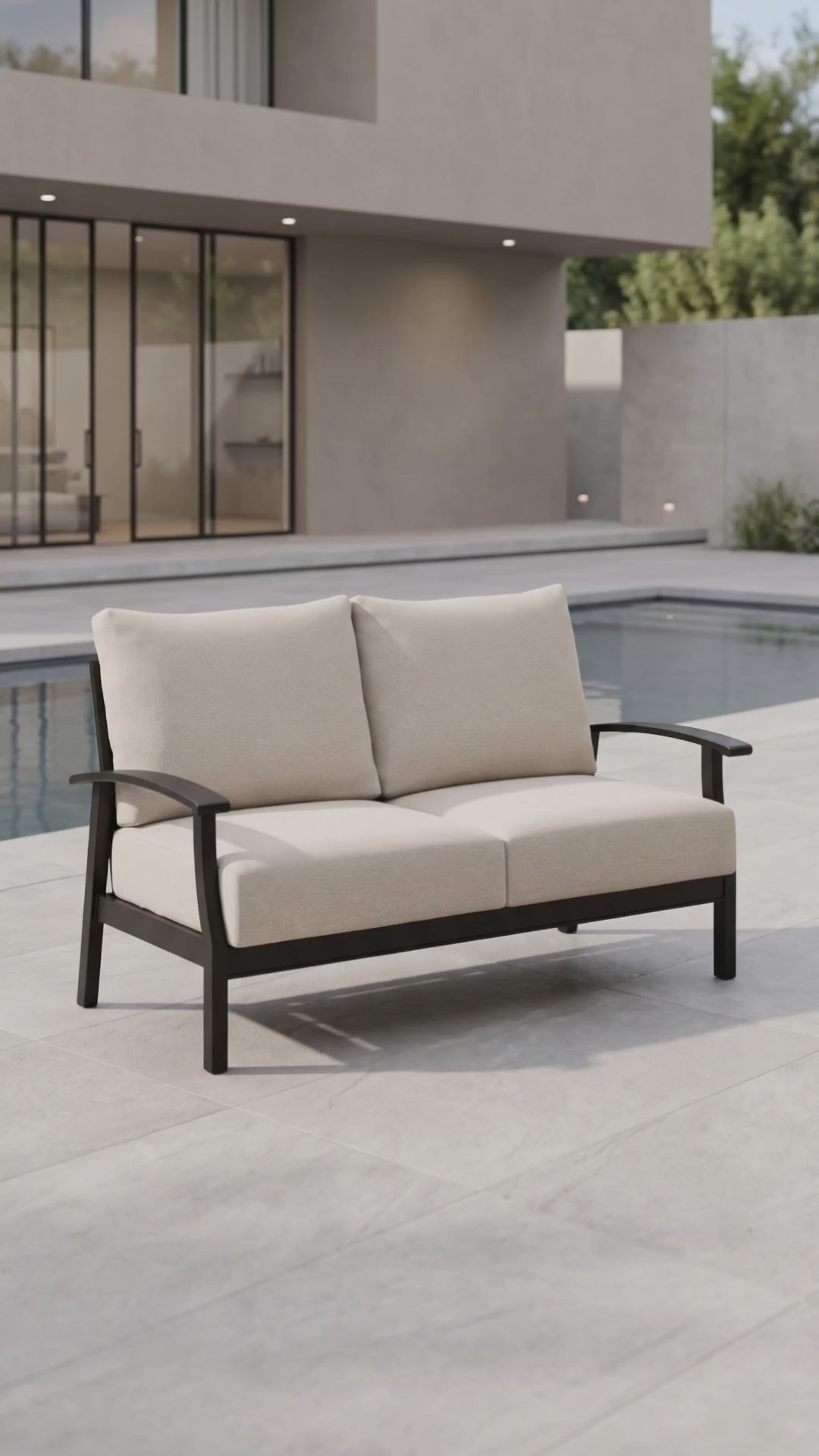Paddy O' Furniture Newport outdoor loveseat with plush cushions for luxury patio relaxation.