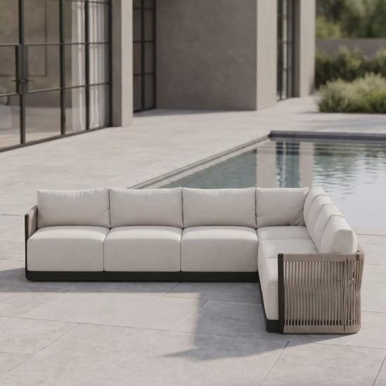 Paddy O' Furniture Resort 7-Seat Sectional outdoor sofa with plush cushion seating.