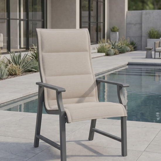 Rockport padded sling dining chair on a sunny outdoor garden patio.