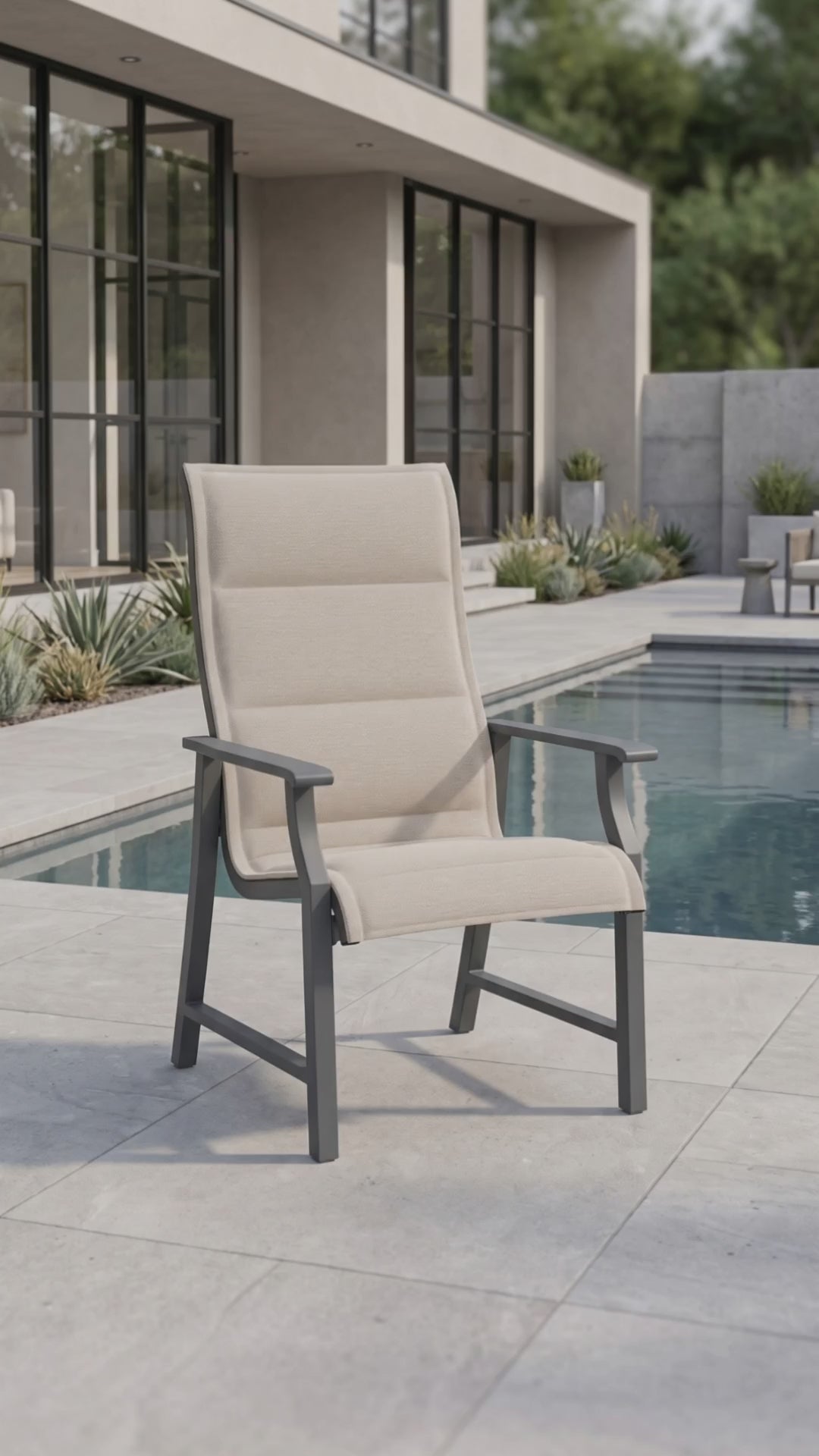 Rockport padded sling dining chair on a sunny outdoor garden patio.