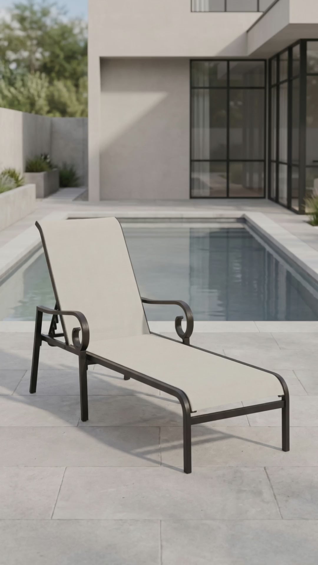 Paddy O' Furniture Rancho Sling Chaise Lounge with a sleek frame and breathable mesh sling surface for outdoor relaxation.