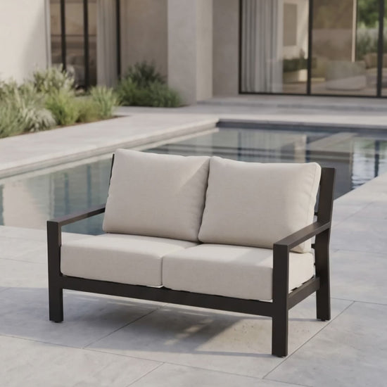 Elegant Peninsula outdoor loveseat featuring premium frame construction and plush Bliss seating cushions by Paddy O' Furniture