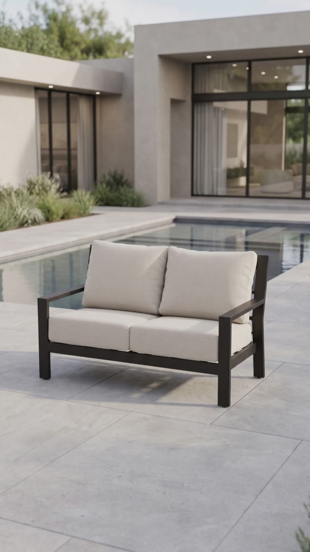 Elegant Peninsula outdoor loveseat featuring premium frame construction and plush Bliss seating cushions by Paddy O' Furniture